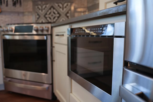 219 Middle Rd, Skowhegan, ME 04976 - kitchen with stainless steel range and white cabinetry