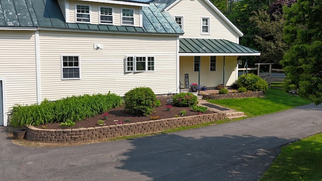 219 Middle Rd, Skowhegan, ME 04976 - view of front of house with a standing seam roof, covered porch, and metal roof