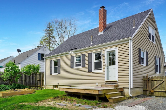 134 Saco St, Westbrook, ME 04092 - back of property featuring a chimney and a shingled roof
