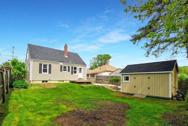134 Saco St, Westbrook, ME 04092 - back of property with a chimney and a wooden deck