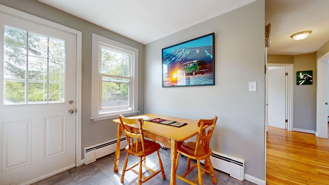 134 Saco St, Westbrook, ME 04092 - dining space featuring a baseboard heating unit, healthy amount of natural light, and baseboards