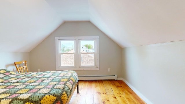 134 Saco St, Westbrook, ME 04092 - bedroom with a baseboard radiator, light wood-type flooring, lofted ceiling, and baseboards