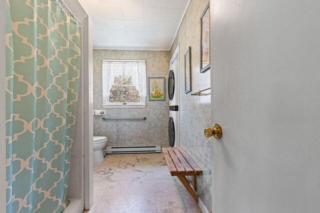 full bath featuring a baseboard heating unit, wallpapered walls, and toilet
