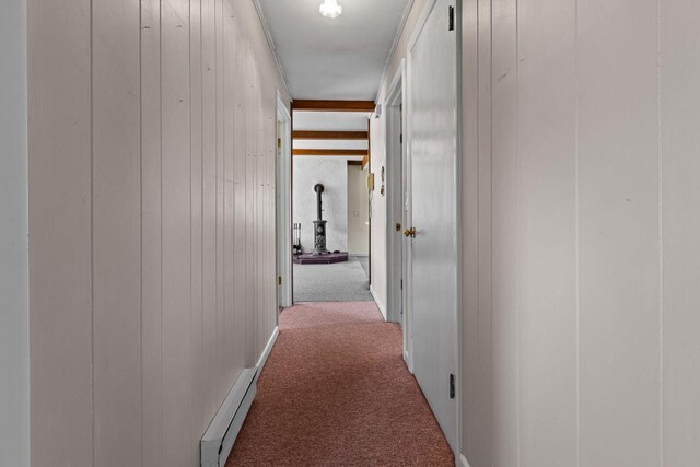 corridor with carpet floors and wooden walls