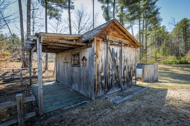 view of outdoor structure with an outdoor structure and fence