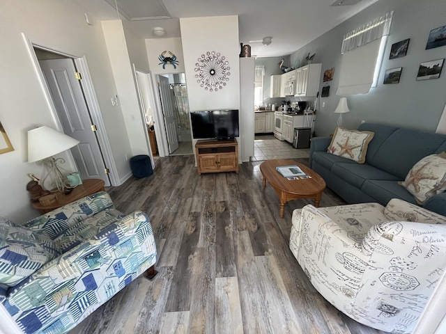 454 Post Rd Unit 456, Wells, ME 04090 - living room with dark wood finished floors and attic access