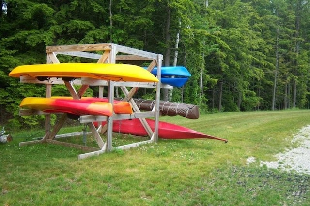 454 Post Rd Unit 456, Wells, ME 04090 - view of playground with a view of trees and a lawn
