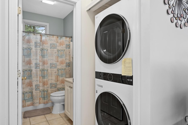 454 Post Rd Unit 456, Wells, ME 04090 - full bathroom featuring stacked washer / drying machine, tile patterned floors, toilet, and a shower with shower curtain
