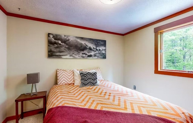 bedroom featuring crown molding and carpet