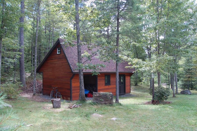 view of property exterior featuring a lawn