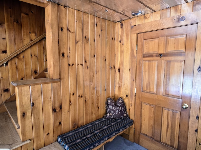 interior space featuring wood walls