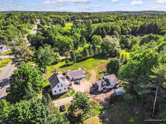 aerial view featuring a wooded view