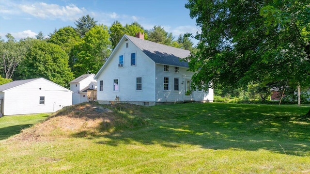 817 Riverside Dr, Augusta, ME 04330 - back of property with a chimney and a yard