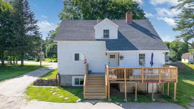 817 Riverside Dr, Augusta, ME 04330 - back of property with a chimney, a deck, a yard, roof with shingles, and stairs