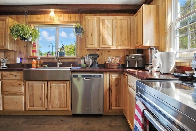 817 Riverside Dr, Augusta, ME 04330 - kitchen featuring stainless steel appliances, dark countertops, light brown cabinets, and wooden walls
