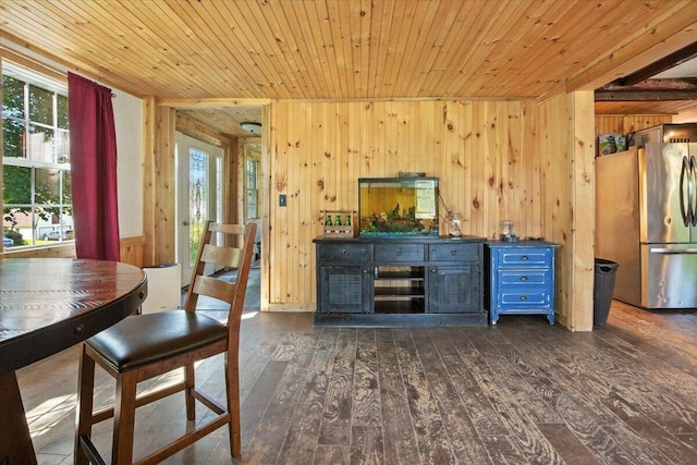 817 Riverside Dr, Augusta, ME 04330 - dining room featuring wooden ceiling, wood walls, and hardwood / wood-style floors