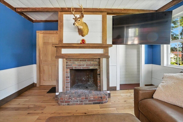 817 Riverside Dr, Augusta, ME 04330 - living room featuring wood ceiling, wood finished floors, plenty of natural light, and a fireplace