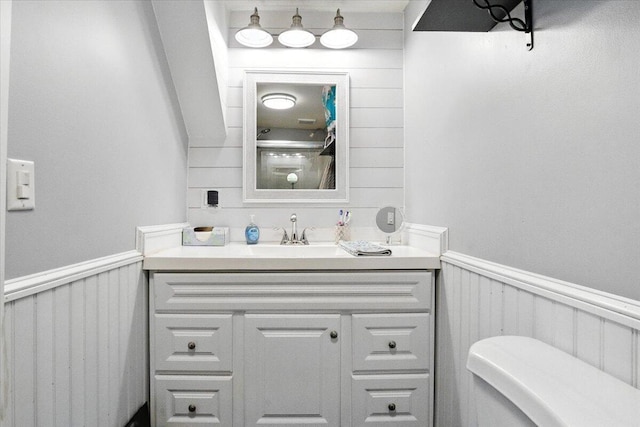 817 Riverside Dr, Augusta, ME 04330 - bathroom featuring vanity, a wainscoted wall, and a decorative wall