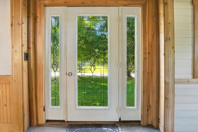 817 Riverside Dr, Augusta, ME 04330 - doorway featuring plenty of natural light and wood walls