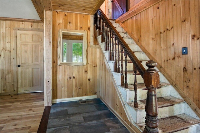817 Riverside Dr, Augusta, ME 04330 - staircase with wooden walls and baseboards