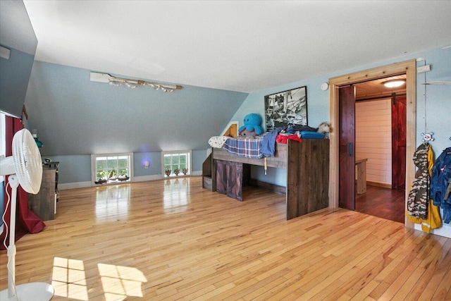817 Riverside Dr, Augusta, ME 04330 - bedroom featuring hardwood / wood-style flooring, track lighting, and vaulted ceiling