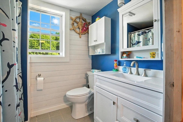 817 Riverside Dr, Augusta, ME 04330 - full bathroom with wooden walls, vanity, tile patterned floors, and a shower with curtain