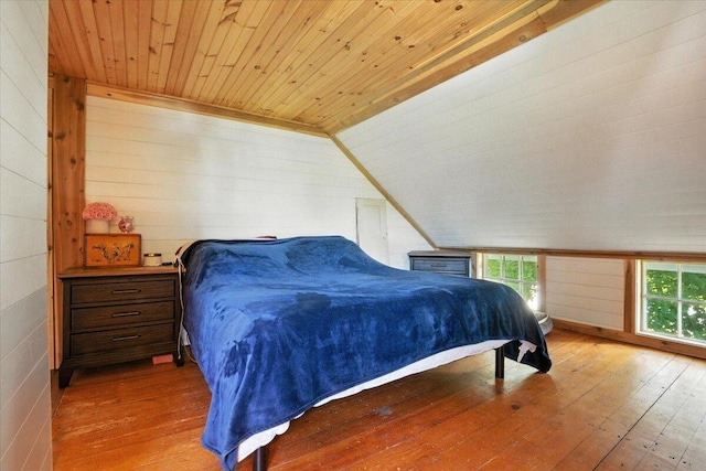 817 Riverside Dr, Augusta, ME 04330 - bedroom with wooden ceiling, multiple windows, wood-type flooring, vaulted ceiling, and wooden walls