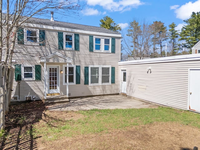 back of house with a patio