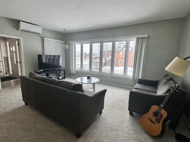 living room featuring carpet floors, a textured ceiling, and a wall mounted AC