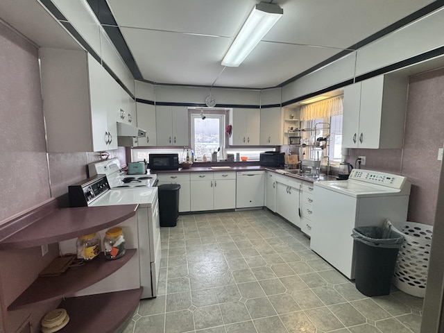 kitchen with range with electric cooktop, black microwave, washer / clothes dryer, and open shelves