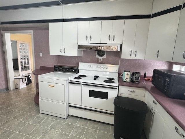 kitchen with tile patterned floors, white range with electric stovetop, black microwave, white cabinetry, and washer / clothes dryer