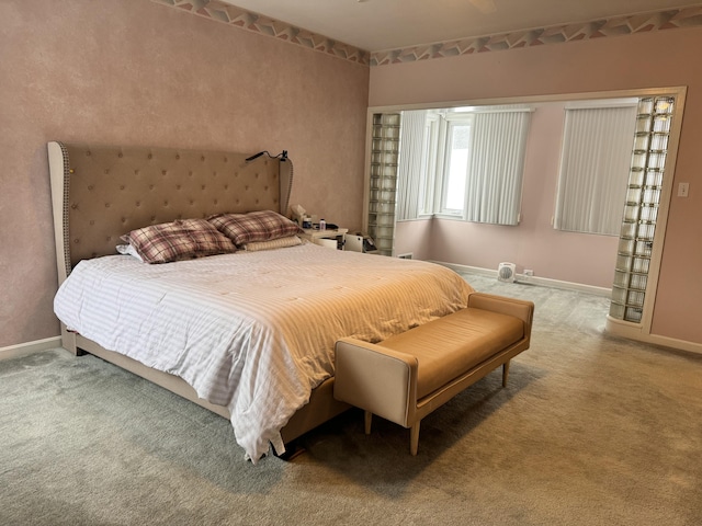 bedroom featuring carpet floors and baseboards