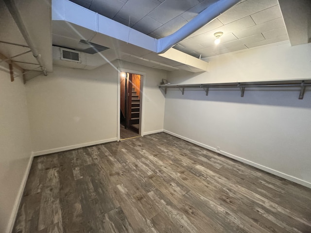 walk in closet featuring wood finished floors and visible vents