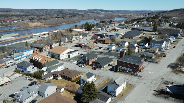 drone / aerial view with a water and mountain view