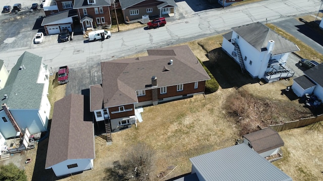 birds eye view of property with a residential view