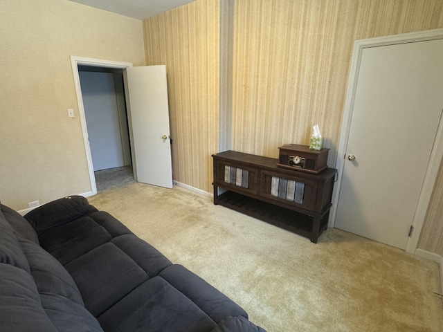living room featuring baseboards and carpet