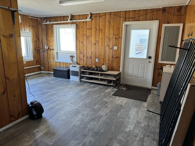 interior space with wooden walls and wood finished floors