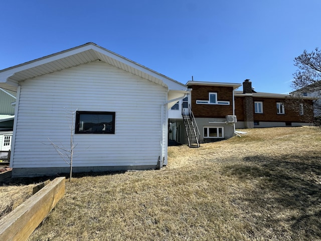 back of house with stairs