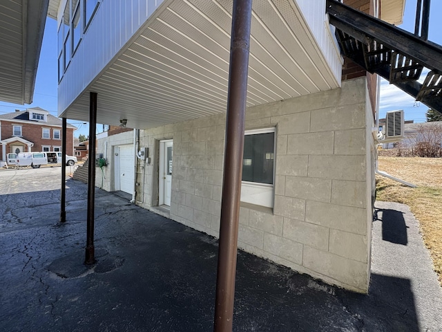 view of home's exterior featuring concrete block siding