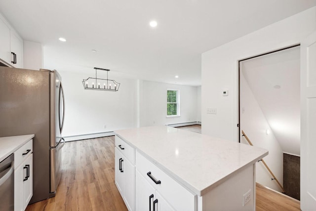 LOT87-1-2 Drown Rd, Alfred, ME 04002 - kitchen with appliances with stainless steel finishes, white cabinets, a center island, and a baseboard heating unit