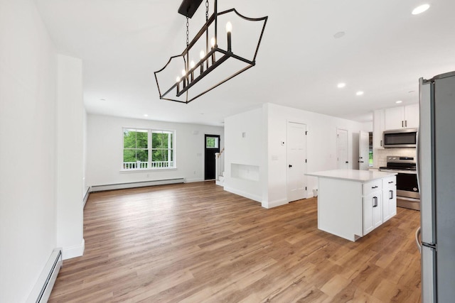 LOT87-1-2 Drown Rd, Alfred, ME 04002 - kitchen with a baseboard radiator, light wood-style flooring, appliances with stainless steel finishes, and light countertops