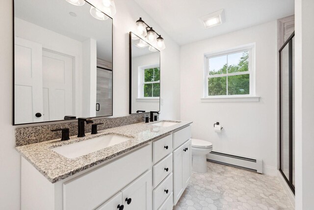 LOT87-1-2 Drown Rd, Alfred, ME 04002 - full bath featuring a sink, a shower stall, a baseboard heating unit, and double vanity