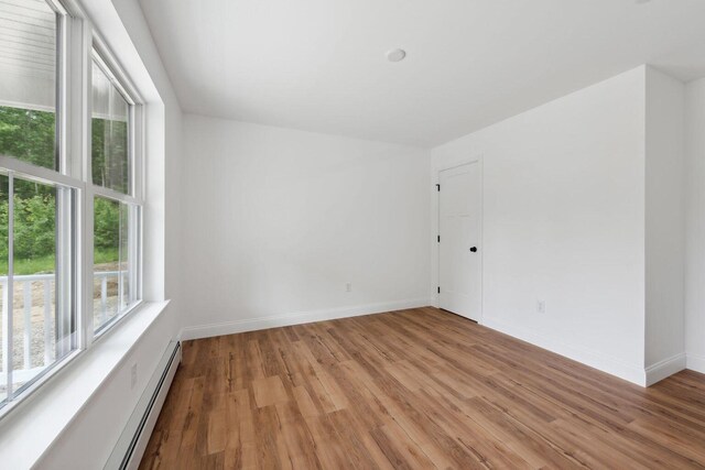 LOT87-1-2 Drown Rd, Alfred, ME 04002 - empty room featuring baseboards, a baseboard heating unit, and light wood-style flooring