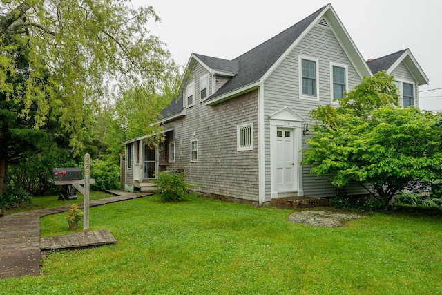 228 Atlantic Ave, Boothbay Harbor, ME 04538 - rear view of house with a yard and roof with shingles