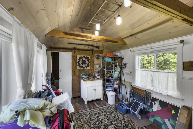 miscellaneous room with a barn door, wood walls, wood ceiling, lofted ceiling, and dark wood-style floors