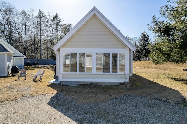 view of side of property featuring fence