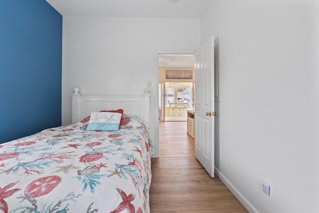 bedroom featuring light wood-style floors