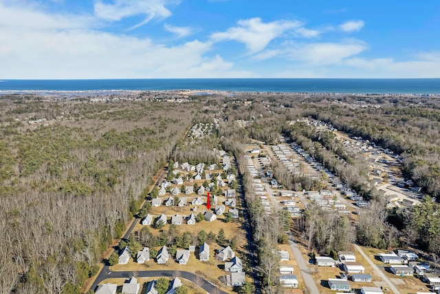 drone / aerial view featuring a residential view and a water view