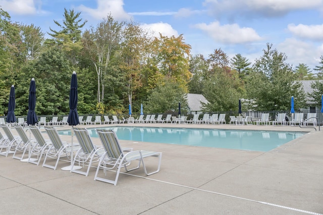 pool featuring a patio area and fence
