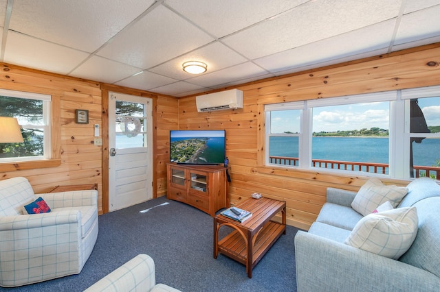 43 W Shore Rd, Harpswell, ME 04003 - living area with carpet, an AC wall unit, wood walls, and a paneled ceiling